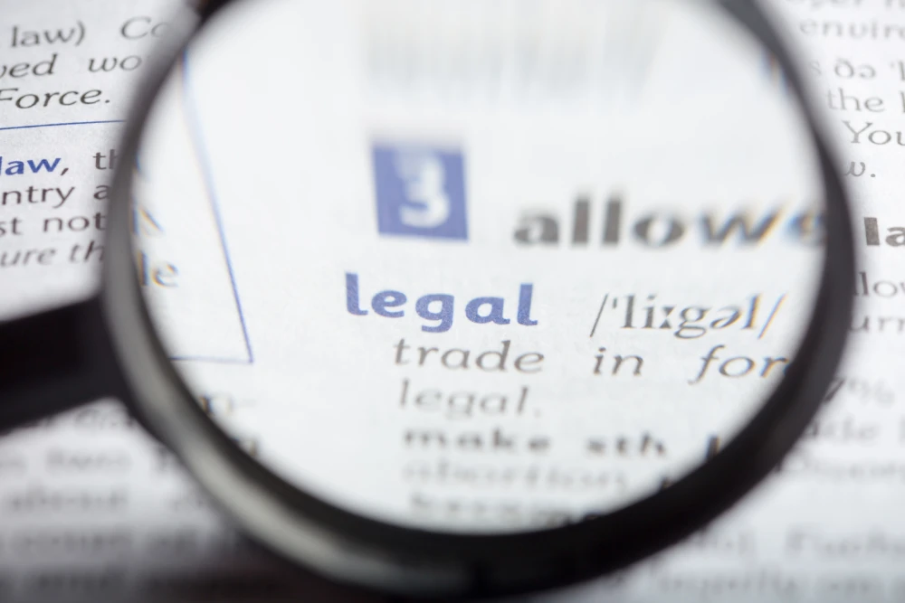lupa nad napisem legal w słowniku